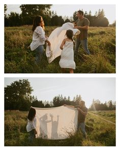 two people holding up a white sheet in a field