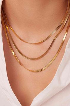 Pair this triple-layered snake chain necklace with a low-key T-shirt for a casual aesthetic. Picture style: Studio, ghost mannequin, flat lay Features: Triple-layered, snake chain Material: Stainless steel Care: Avoid wearing during exercise, as sweat will react with the jewelry to produce silver chloride and copper sulfide. Imported Product measurements: Chain 1: 15.35 inChain 2: 16.93 inChain 3: 18.5 inChain width: 0.11 in (0.3 cm)Extension chain length: 2.16 inWeight: 0.55 ounce (15.8 g) Mafia Wives, Ghost Mannequin, Layered Chain Necklace, Snake Chain Necklace, Aesthetic Picture, Picture Style, Layered Chains, Classy Jewelry, Gold Snake