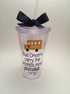 a plastic cup with a black bow on the top that says bus drivers carry the world's most precious cargo