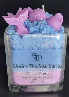 a small container filled with blue and pink candy