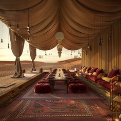 a long table with lots of red pillows on top of it next to couches and lamps