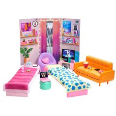 a doll house with furniture and accessories including a bed, couch, tv, coffee table