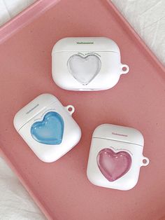 three heart shaped toasters sitting on top of a pink tray