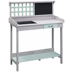 a desk with a computer on top of it and drawers underneath the desk is white