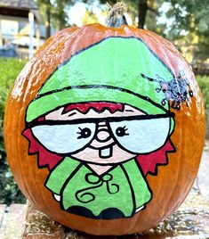 a painted pumpkin with a cartoon character on it