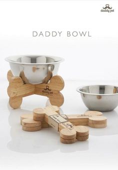 three bowls and two wooden spoons on a white surface