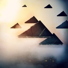 a group of pyramids floating in the air