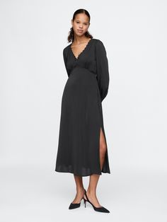 Soft satin midi dress.  Lace-trim V-neck.  Long sleeves.  Empire waist.  Slit at the hem.  Fit: Slim.  An A-line silhouette that sits close to the body with a flared opening.  Hits below the knee.  Models wearing Gap Amazon Black Dress, Midi Dress Black, Satin Midi Dress, Black Long Sleeve Dress, Mom Dress, Lace Midi Dress, Dress Lace, Black Midi Dress, Empire Waist