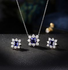 "❤ Item Details: Metal: Sterling Silver / Rose gold Plated / Yellow gold Plated OR 10K/ 14K/ 18K Solid Gold (White gold / Rose gold / Yellow gold) Necklace Center Stone: Lab Sapphire  Stone Color/ Clarity: DEF, VVS1 Shape: 6 mm Asscher Side Stone: Moissanite / Cubic Zircon Stone Color/ Clarity: DEF, VVS1 Shape: 3 mm(8) Round Pendant Size: Approx 13.55 mm Chain Style: Cable Earrings Center Stone: Lab Sapphire  Stone Color/ Clarity: DEF, VVS1 Shape: 5 mm Asscher Side Stone: Moissanite / Cubic Zirc Sapphire Jewelry Sets For Gifts, Sapphire Diamond Jewelry Sets As Gifts, Sapphire Diamond Jewelry Sets For Gift, Sapphire Fine Jewelry Sets For Gifts, Yellow Gold Cubic Zirconia Jewelry Sets With Matching Earrings, Fine Jewelry Sapphire With Matching Earrings, Fine Jewelry Sets With Gemstones For Anniversary, Elegant Sapphire Jewelry Sets For Gifts, Formal Sapphire Moissanite Jewelry