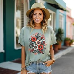 Looking for a cute versatile top to wear? Make sure to grab one of our Graphic tees! This soft and comfortable graphic tee is the perfect top for any outfit. It can be paired with biker shorts, jeans, or even a simple skirt/dress! This tee is true-to-size, so be sure to order your regular t-shirt size! If you are looking for a more oversized look, make sure to size up! Everyday Floral Print Graphic Tee Tops, Everyday Floral Print Crew Neck Top, Floral Print Crew Neck Top, Cute Green Everyday Tops, Everyday Short Sleeve Printed Tops, Everyday Printed Graphic Tee Tops, Everyday Printed Short Sleeve Tops, Everyday Printed Graphic Tee, Printed Graphic Tee For Everyday