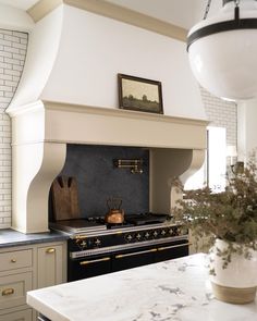 a kitchen with an oven, stove and counter tops in it's center island