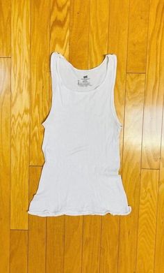 An awesomely distressed & broken in white ribbed cotton Hanes undershirt / wifebeater / tank top.  Distressed from the 90s Grunge club era here in the PNW.  Has a ton of stretch and the original vintage label size is L but, as always, please check current approximate measurements for size. Gender neutral. 💥Condition: Excellent vintage distressed condition. Has a couple of light greyish streaks across the front center -- see pix. No holes, tears, rips, etc.  Measurements are taken while the garm Wifebeater Tank Top, Off White Tank Top, Crew Neck Cotton Tank Top With Distressed Detail, Distressed Cotton Crew Neck Tank Top, Distressed Cotton Tank Top With Crew Neck, White Distressed Fitted Tops, White Fitted Distressed Tops, Fitted White Distressed Tops, Distressed Fitted Cotton Tank Top