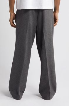 A roomy fit emphasizes the vintage spirit of pants tailored from a softly felted wool blend with flat-front construction and an easy, wear-everywhere feel. Exclusive retailer 30 1/2" inseam; 21" leg opening; 13 1/2" front rise; 20 1/2" back rise (size 32) Zip fly with button closure Front slant pockets; back button-welt pockets Adjustable buckle side tabs 50% wool, 40% polyester, 10% other fibers Machine wash, tumble dry Imported Pants Tailored, Military Pants, Felted Wool, Easy Wear, Welt Pockets, The Vintage, Wool Felt, Wool Blend, Nordstrom