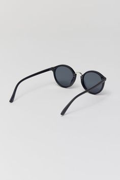 Round silhouette sunglasses with a plastic frame. Features a metal nose piece and temple accents. Fitted with tinted UV-blocking lenses. Features Plastic frame sunglasses Metal accents Tinted UV-blocking lenses Content + Care Polycarbonate, metal Wipe clean Imported Size Bridge: 20mm Width: 50mm Height: 46mm | Myrtle Round Sunglasses in Black, Men's at Urban Outfitters Nose Piece, Metal Accents, Metallic Accents, Sunglass Frames, Round Sunglasses, Urban Outfitters, Temple, Lenses, Bridge