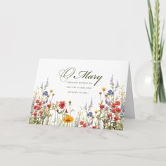 a card with flowers and the word o mary on it