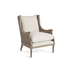 the arm chair is made from wicker and has a white cushion