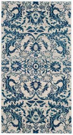 a blue and white rug with an intricate design