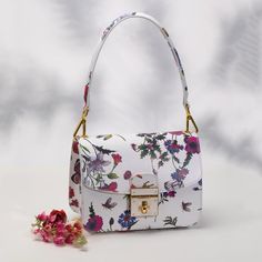 Nwot Genuine Leather Made In Italy Primavera Floral Handbag Our Primavera Handbag Is The Perfect Example Of What Can Happen When Each Of The Four Elements Of Handbag Mastery Is Executed Flawlessly. The Primavera Is Crafted From Gorgeous Italian Leather, In A Whimsical Floral Pattern That Recalls The Intoxicating First Days Of Spring. Proportion, Line, Material And Finish-The Primavera Is The Full Package! Specifications Made In Italy 81/2" X 41/2" X 6 1/2" 100% Calf Leather Floral Printed Oneint Luxury White Flap Bag With Removable Pouch, Luxury White Shoulder Bag With Adjustable Strap, Luxury White Shoulder Flap Bag, Luxury White Flap Shoulder Bag, White Luxury Clutch Bag, Luxury White Clutch Bag, Luxury White Box Bag With Adjustable Strap, Luxury White Box Bag Shaped As Clutch, White Luxury Bag With Adjustable Strap