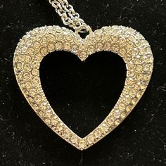 A Flared Silver Heart Is Encrusted In Glassy White Rhinestones, Resulting In A Romantic Shimmer At The Bottom Of An Extended Silver Chain. Never Worn. Elegant Heart Necklace With Rhinestones For Parties, Elegant Crystal Rhinestone Heart Necklace, Crystal Heart Pendant Necklace For Party, Elegant Heart-shaped Rhinestone Necklace For Valentine's Day, Valentine's Day Party Crystal Heart Necklace, Elegant Heart-shaped Rhinestone Necklace For Parties, Glamorous Heart Necklaces For Valentine's Day, Glamorous Crystal Necklace For Valentine's Day, Heart-shaped Rhinestone Necklace For Valentine's Day Party