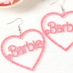 Brand New! Gorgeous Sparkling Barbie Dangling Earrings! Perfect Gift For The Barbie Lovers In Your Life! Roughly 2 Inches In Height & 2 - 1/2 Inches In Width. Prettier In Person! Color May Vary Slightly But They Are 'Barbie' Pink Show Your Barbie Love With These Gorgeous Acrylic Pink Sparkling Barbie Earrings! Perfect For Day Or Night. Perfect Present Or Gift For The Lovely Lady In Your Life! Ask Me How To Get $4.99 Shipping Every Friday! Exaggerated Acrylic Resin Handmade Earrings Jewels Jewelr Cute Party Earrings For Mother's Day, Cute Earrings For Mother's Day Party, Pink Hypoallergenic Plastic Earrings, Playful Personalized Pink Earrings, Playful Heart Shaped Party Earrings, Playful Heart-shaped Earrings For Parties, Trendy Heart Earrings For Birthday, Trendy Heart-shaped Earrings For Birthday, Playful Heart-shaped Party Earrings