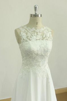 a white wedding dress on a mannequin