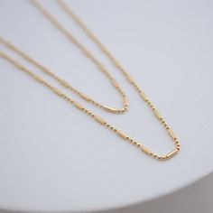 the namesake of our shape of you collection, this necklace embodies the concept behind the collection: taking it back to basics with simple, everyday, elevated pieces. 18kt gold BR gold filled available in 16" or 18" in length Minimalist Cable Chain Necklaces For Everyday Use, Minimalist Cable Chain Necklace For Everyday Use, Minimalist Gold Necklace With Satellite Chain, Modern 14k Gold Necklace For Everyday, Minimalist Double Strand Everyday Necklaces, Minimalist Layered Necklace With Satellite Chain, Gold Satellite Chain Necklace For Everyday, Everyday Gold Satellite Chain Necklace, Dainty 14k Gold Filled Necklace For Everyday