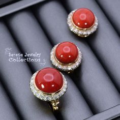 Stunning rare oxblood red coral diamond ring and earring set! They are set in 14k yellow gold and each coral cabochon is surrounded with diamonds! Ring Information: Ring Size: 8 -Weight: 11.5 grams -Precious Metal: 14k yellow gold Precious stones: -Coral Center Stone: 13ct, 15.5mm -Round Diamonds: 0.72 carat Earring Information: -0.7 inch long -Total Weight: 17.8 grams -Precious Metal: 14k yellow gold Precious Stones: -Coral: 13.8mm, 16 carat (total) -Round Diamonds: 1 carats (total) Elegant Red Cabochon Jewelry, Elegant Red Jewelry With Cabochon, Elegant Yellow Gold Jewelry With Red Coral, Exquisite Red Cabochon Jewelry, Formal Yellow Gold Jewelry With Red Coral, Gold Round Red Coral Jewelry, Gold Red Coral Round Jewelry, Classic Red Coral Formal Jewelry, Luxury Red Coral Jewelry For Formal Occasions