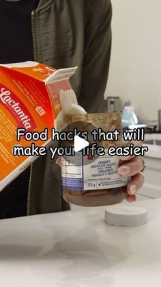 a person holding a bag of food in front of a counter with the caption, food hacks that will make you life easier