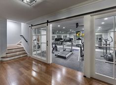 a home gym with treadmills and exercise equipment