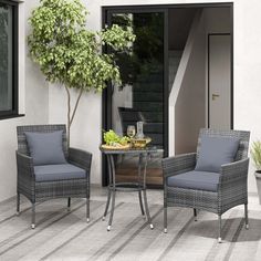 two chairs and a table on a patio