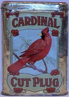 an old tin can with a red cardinal on it's side and words cut plug