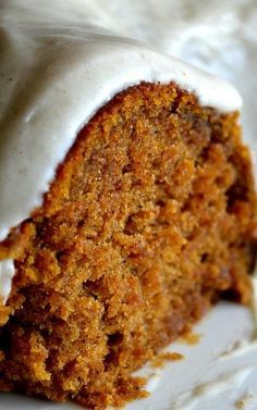 a piece of carrot cake with white frosting