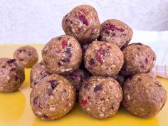 a pile of oatmeal energy bites sitting on top of a yellow table