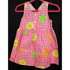 SWAT Dress Pink plaid flower dress Yellow, green, and orange sunflowers 3 white buttons in the front Light breathable fabric No noticeable stains or odors Approximate weight: 3 oz Baby size 2T Approximate measurements: Armpit to pit: 10 in (25.5 cm) Strap length: 1.5 in (4 cm) Shoulder width: 6.5 in (16.5 cm) Waist: 20 in Hip: 34 in Total length: 17 in (43 cm) Playful Cotton Dresses With Buttons, Spring Playtime Fitted Sundress, Casual Floral Print Sundress For Playtime, Fitted Gingham Dress With Floral Print, Cotton Floral Print Sundress For Playtime, Summer Gingham Dress With Button Closure, Cotton Buttoned Dress For Picnic, Casual Green Sundress For Playtime, Cotton Dresses With Buttons For Picnic