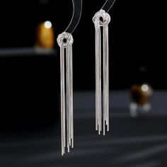 Color: Gold, Silver Fashion Element: Tassel Style: Niche Silver Dangle Earrings With Tassels, Trendy Silver Tassel Drop Earrings, Trendy Silver Dangle Tassel Earrings, Silver Dangle Tassel Earrings, Elegant Adjustable Tassel Drop Earrings, Adjustable Silver Tassel Earrings For Party, Minimalist Tassel Drop Earrings, Linear Tassel Dangle Earrings, Silver Long Drop Earrings With Tassels