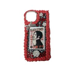 a cell phone case with a woman's face on the front and red beads in the back