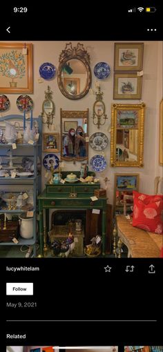 a room filled with lots of different types of plates and vases on the wall