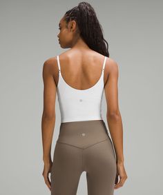 When feeling nothing is everything. Powered by Nulu fabric, this tank with cami-inspired adjustable straps is so weightless and buttery soft, all you feel is your practice. Designed for Yoga. Intended for low-impact activities:Tight fit contours your body:Cropped length is cut above the waist-perfect with high-rise pants. Built-in shelf bra for added support and coverage. Pockets for optional, removable cups. Adjustable straps. Michelle Yeoh, B Cup, Cropped Cami, Ribbed Tank Tops, Top Light, Shelf Bra, Tank Top Cami, Business Casual Outfits, Cami Tanks