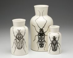 three vases with bugs painted on them