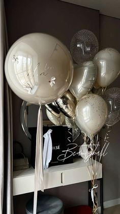 balloons and streamers are arranged on a table