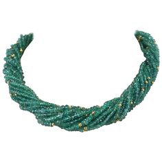 A Genuine & Natural Emerald Faceted with Gold Beads Choker Necklace consisting of 15 lines weighing 540 carats with an 18K Yellow Gold Clasp. The length is 17.50" and the beads range from 2.50MM to 6MM. We can also customize the necklace according to your preferences, as per the number of strands, the size of the beads, the weight, etc. Please contact us for more information. Emerald Beads Necklace, Delicate Diamond Necklace, Necklaces Beaded, Beads Choker, Faceted Bead Necklace, Vintage Beads Necklace, Emerald Bead, Pearl Choker Necklace, Beaded Choker Necklace