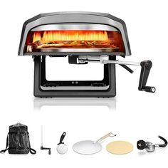 an electric pizza oven is shown with accessories