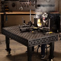 a man in a helmet working on a machine