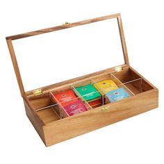 a wooden box with six different types of teas in it on a white background