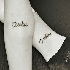 two people with tattoos on their legs and one has the word sisters written in cursive font