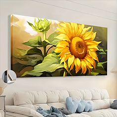 a large sunflower painting on the wall in a living room