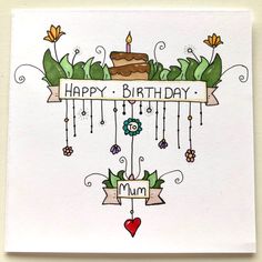 a birthday card with an image of a cake and flowers hanging from it's side