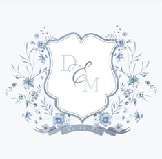 a white and blue floral frame with the letter d and m in it's center