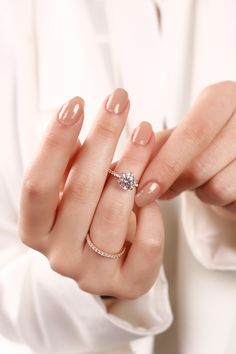 a woman holding onto her engagement ring