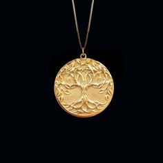 PENDANT INFORMATIONThis pendant is made of real, solid gold.• Made in USA• Material: 14k or 18k solid gold• Finish: polished• Height: 1.1" (28 cm) | *includes the small circle, bail dimensions not included• Width: 0.95" (24 mm)• Pendant weight: approx. 6 grams (14k)• Bail: fits up to 4 mm chains• Solid back, not hollow• A certificate of authenticity is included• Delivered in our elegant jewelry box, making it the perfect gift Shipping: All of our orders are custom-made. Please allow approximatel Yellow Gold Round Pendant Jewelry For Blessing, Symbolic Tree Of Life Round Pendant Jewelry, Large Round Pendant Jewelry For Blessing, Nature-inspired Pendant Jewelry For Meditation, Sterling Silver Yellow Gold Tree Of Life Necklace, Yellow Gold Sterling Silver Tree Of Life Necklace, 14k Yellow Gold Tree Of Life Jewelry, Tree Of Life Round Pendant Jewelry For Anniversary, Spiritual Recycled Gold Round Pendant Jewelry